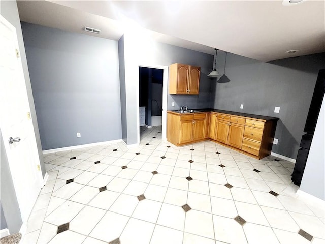 kitchen with hanging light fixtures and sink