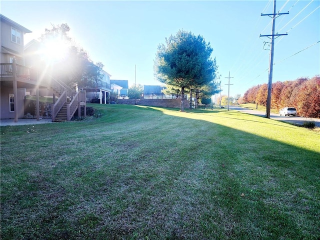 view of yard featuring a wooden deck