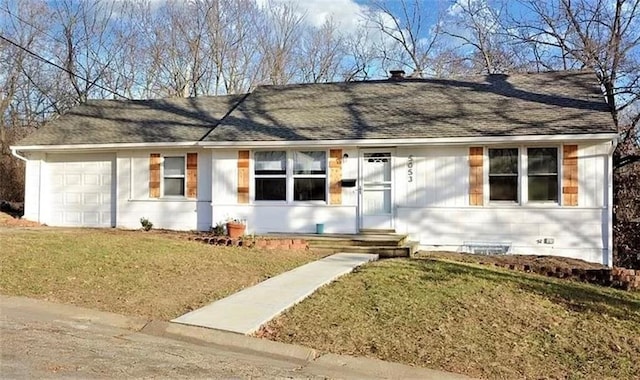 ranch-style house with a garage and a front lawn