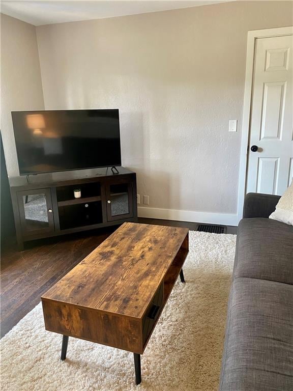 living room featuring dark hardwood / wood-style flooring