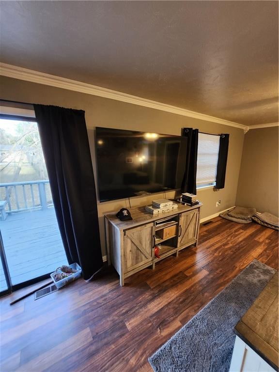 living room with crown molding and dark hardwood / wood-style flooring