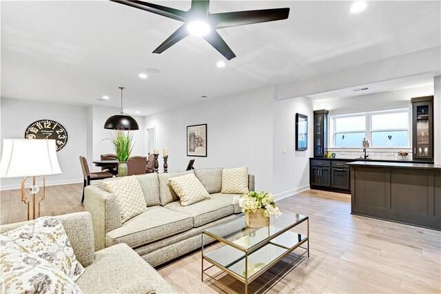 24912 W 98th Pl, Lenexa, KS 66227 - living room with recessed lighting, light wood-style flooring, baseboards, and ceiling fan