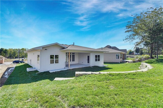 24912 W 98th Pl, Lenexa, KS 66227 - back of property with a patio area and a yard