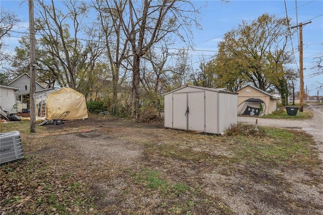 view of outdoor structure with central AC