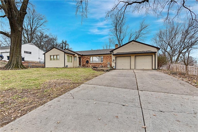 single story home with a front yard and a garage