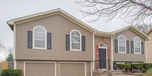 bi-level home featuring a garage