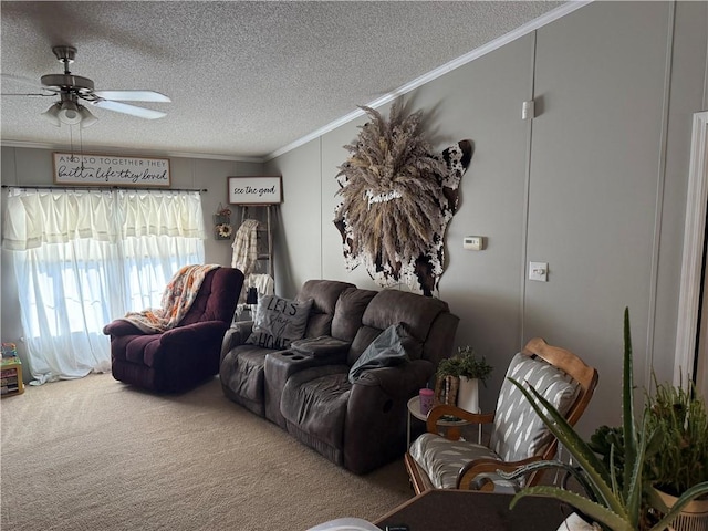 carpeted living room featuring ceiling fan, a textured ceiling, and crown molding