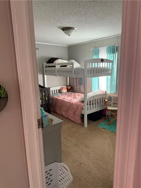 carpeted bedroom with a textured ceiling