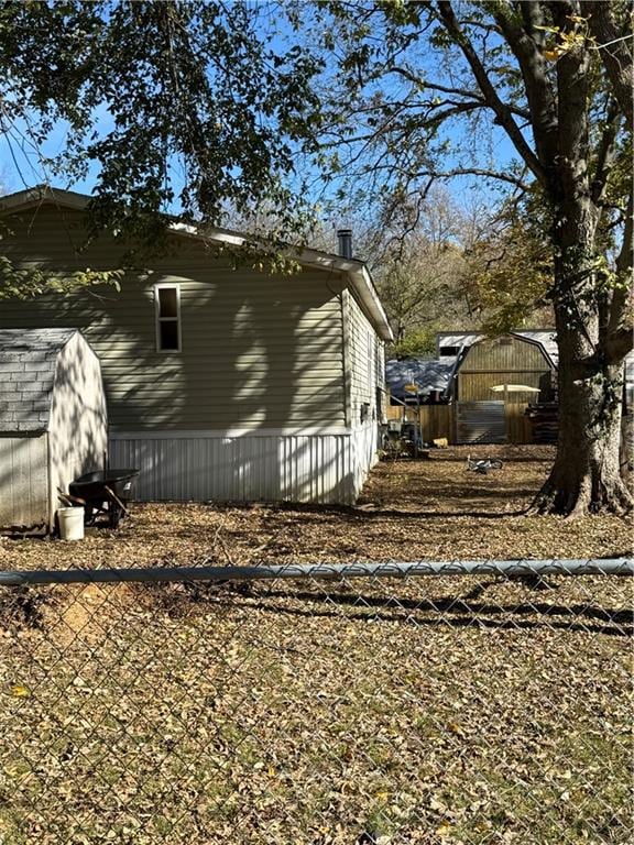 view of home's exterior featuring a storage shed