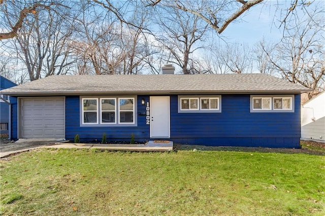 single story home featuring a front lawn and a garage