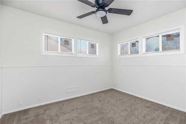 carpeted empty room with ceiling fan