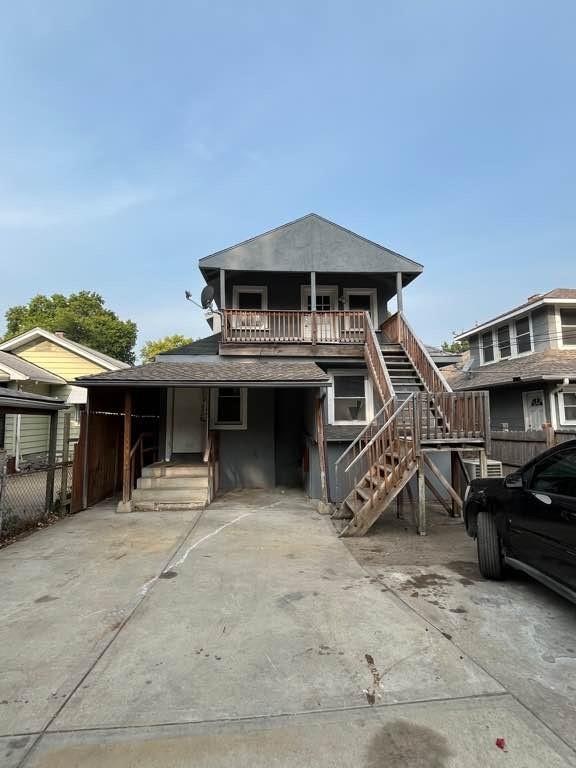 view of front of home with a balcony