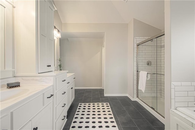 bathroom featuring tile patterned flooring, vanity, and separate shower and tub