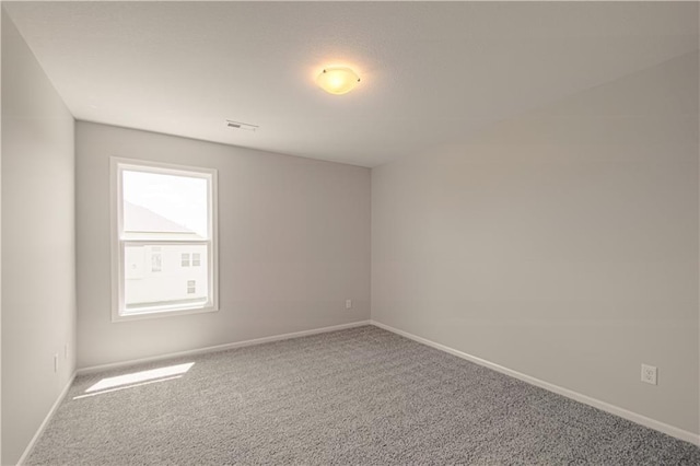 spare room featuring carpet flooring