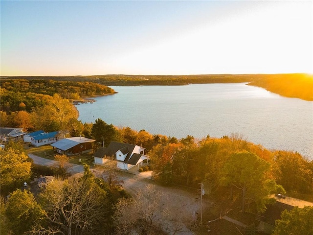 aerial view at dusk with a water view