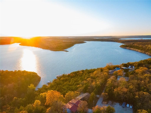 aerial view at dusk with a water view