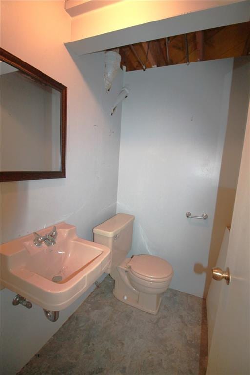 bathroom with toilet and sink