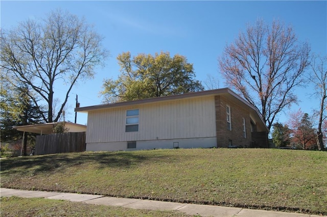 view of property exterior with a lawn