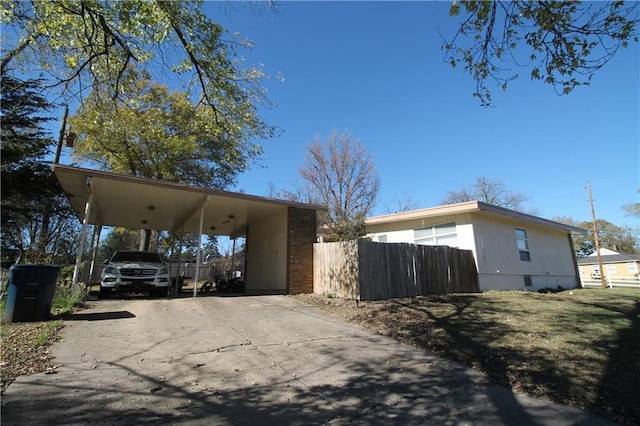 view of home's exterior featuring a carport