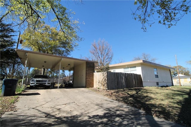 view of side of property with a carport