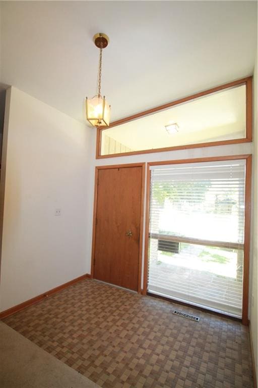 view of carpeted entrance foyer