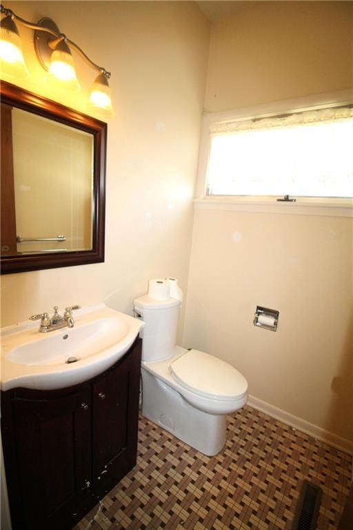 bathroom with vanity and toilet