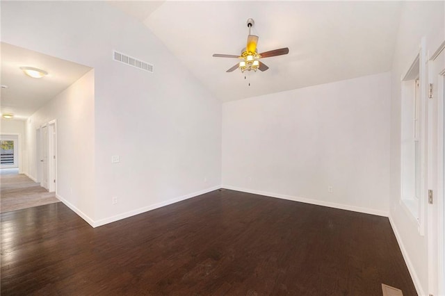 unfurnished room with dark hardwood / wood-style floors, ceiling fan, and vaulted ceiling