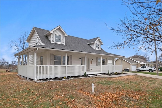 view of front of house with covered porch and a front lawn