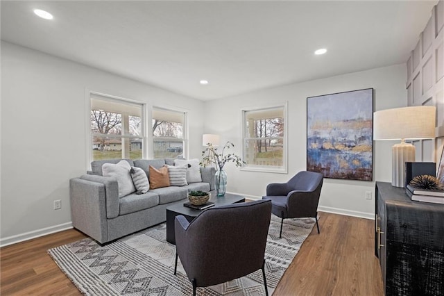 living room featuring hardwood / wood-style flooring and a healthy amount of sunlight