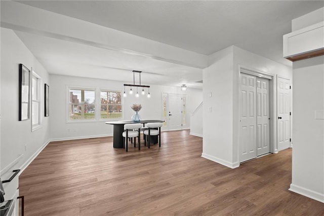 dining area with dark hardwood / wood-style flooring