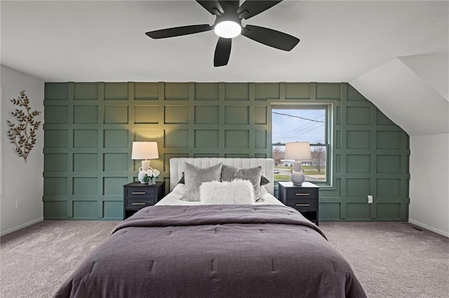 carpeted bedroom featuring ceiling fan and vaulted ceiling