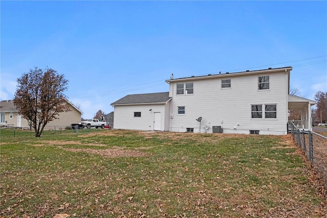 back of house with a lawn and cooling unit