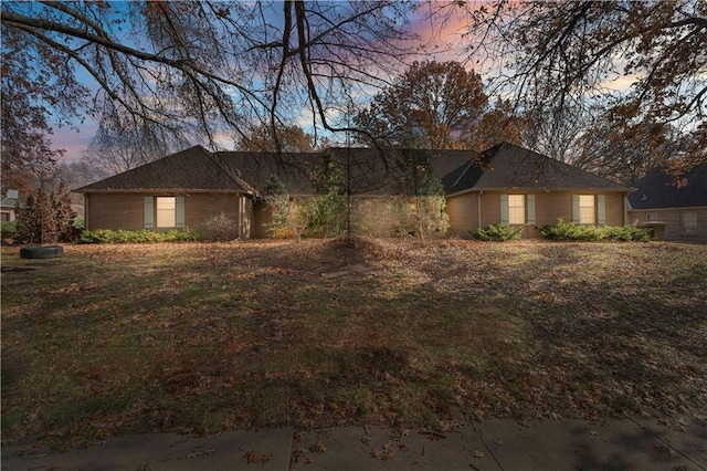 view of front of property with a lawn