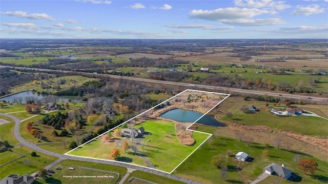 drone / aerial view with a rural view and a water view