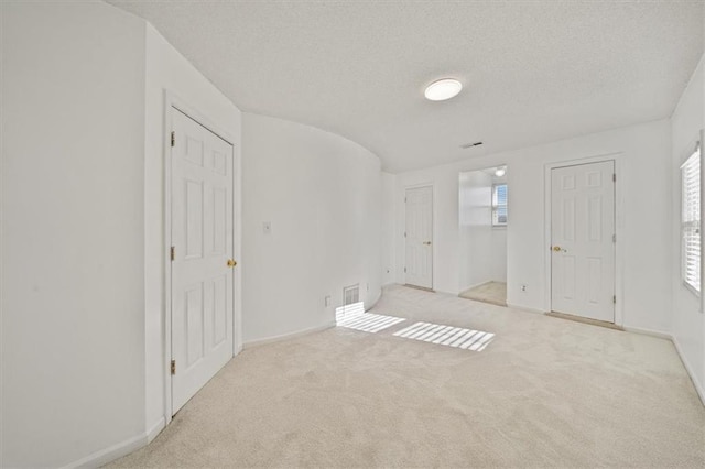 interior space featuring a textured ceiling