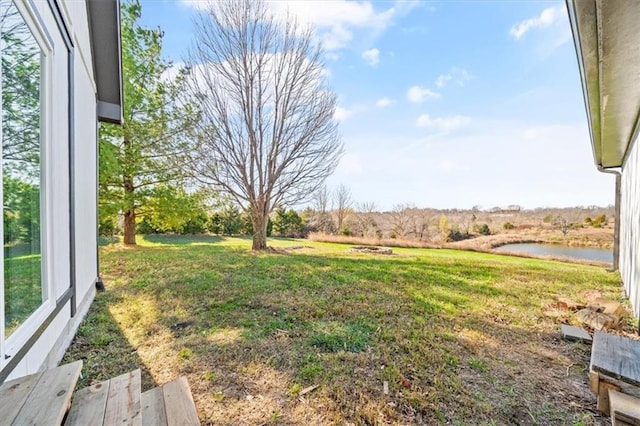 view of yard with a water view