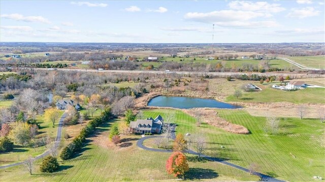 drone / aerial view with a rural view and a water view