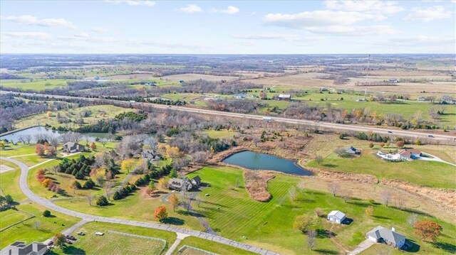 aerial view featuring a rural view and a water view