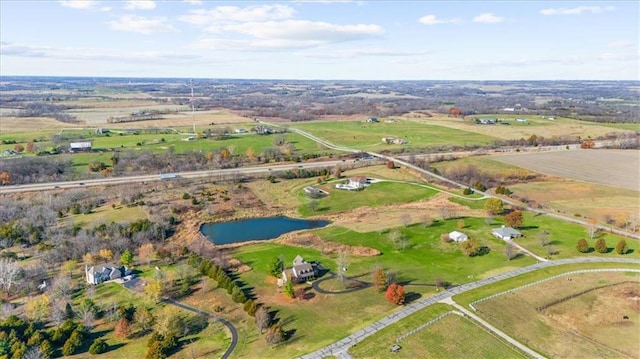 drone / aerial view featuring a rural view and a water view