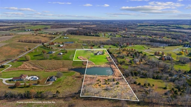 birds eye view of property with a rural view and a water view