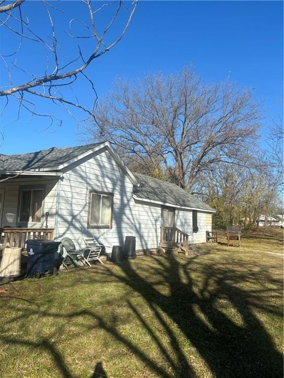 view of home's exterior with a lawn