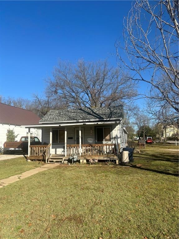 view of front of home with a front lawn and a porch