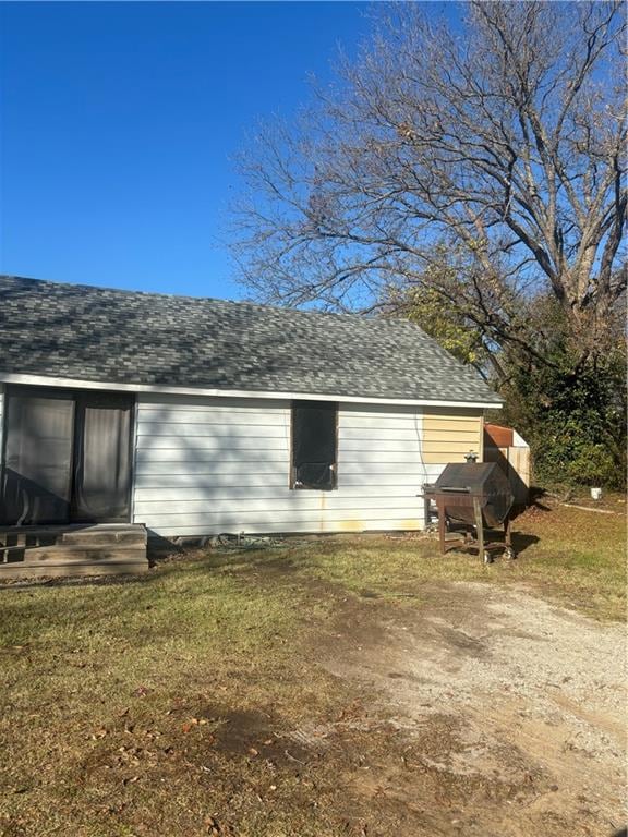 view of home's exterior featuring a yard