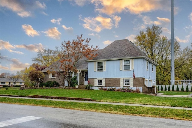 tri-level home with a front yard