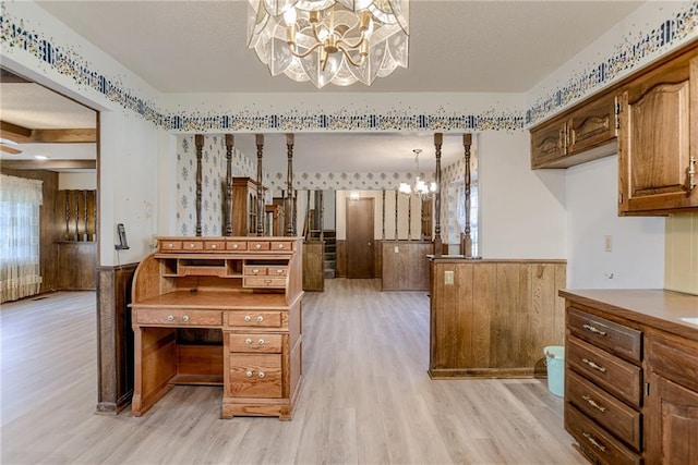 bathroom featuring hardwood / wood-style flooring, vanity, and a notable chandelier