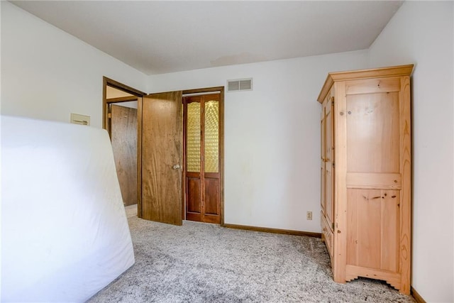 unfurnished bedroom with light carpet