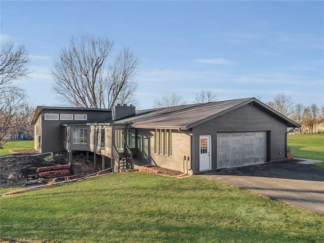 exterior space with a front yard and a garage