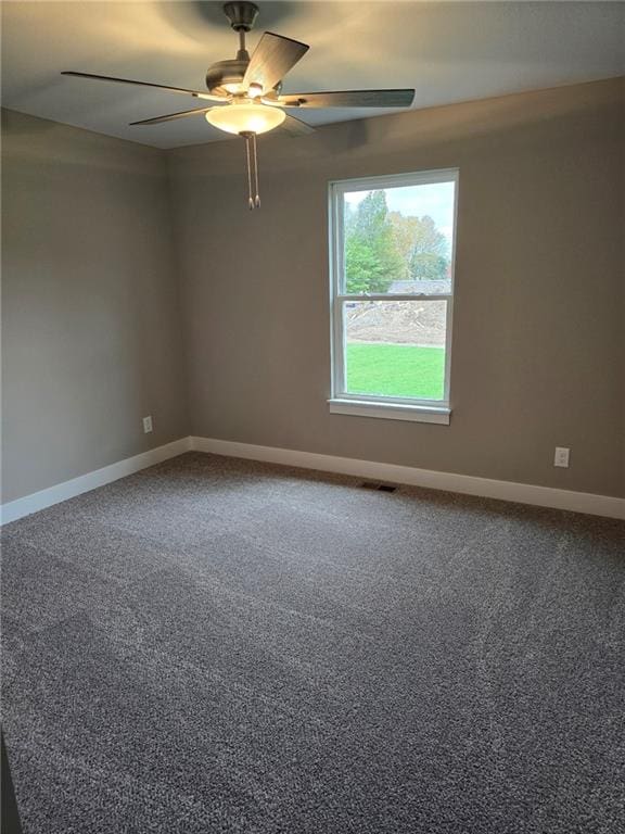 carpeted empty room with ceiling fan