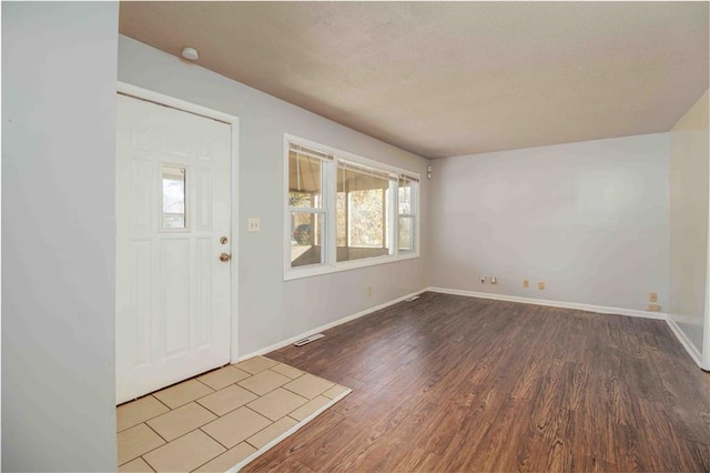 entrance foyer featuring hardwood / wood-style flooring