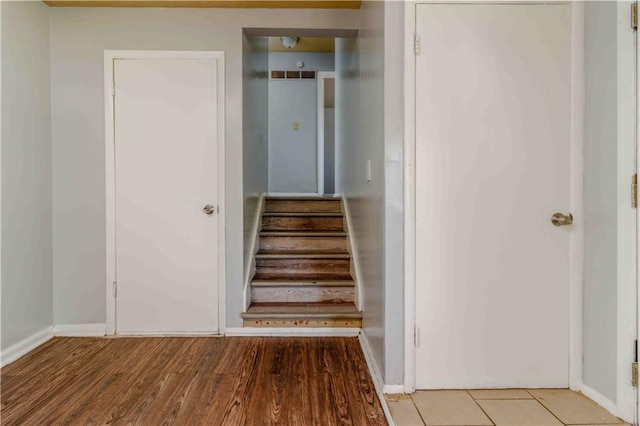 staircase featuring hardwood / wood-style flooring